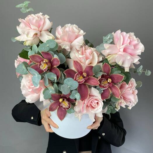 Pink French roses with pink orchids and eucalyptus in a box