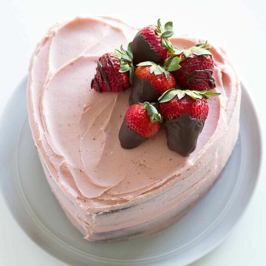 Chocolate dipped pink heart shape cake