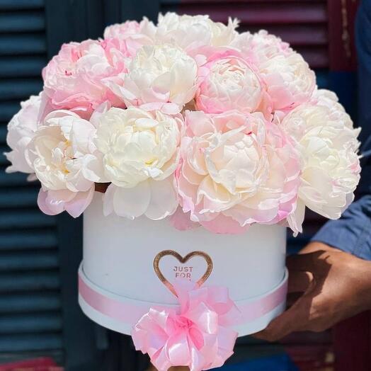 Assorted peonies in a hatbox