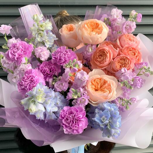 A bright bouquet of Delphinium and a peony-shaped Rose