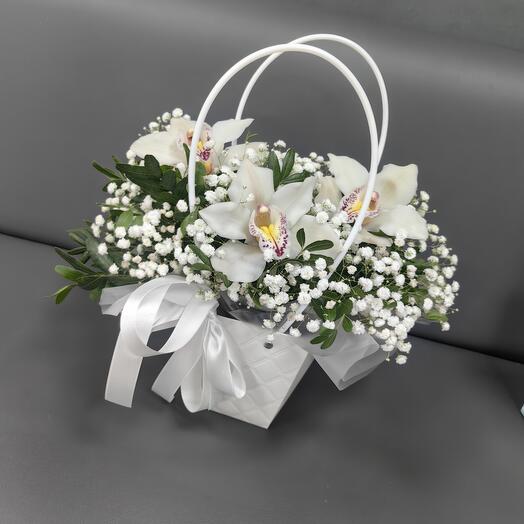 Orquídeas en un bolso Flores en una Caja