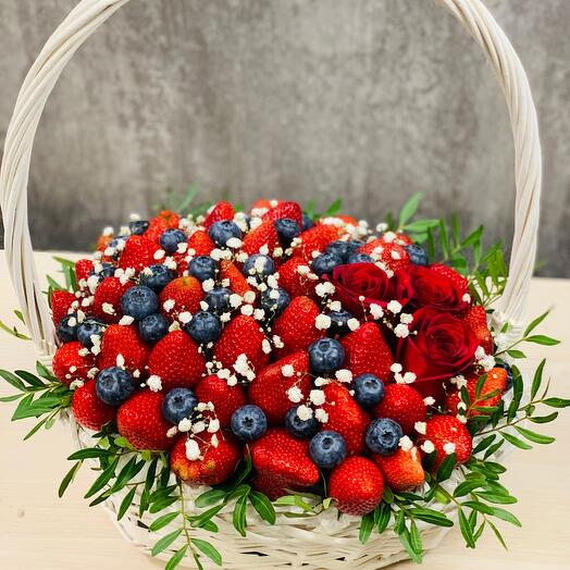 Basket with flowers and strawberries