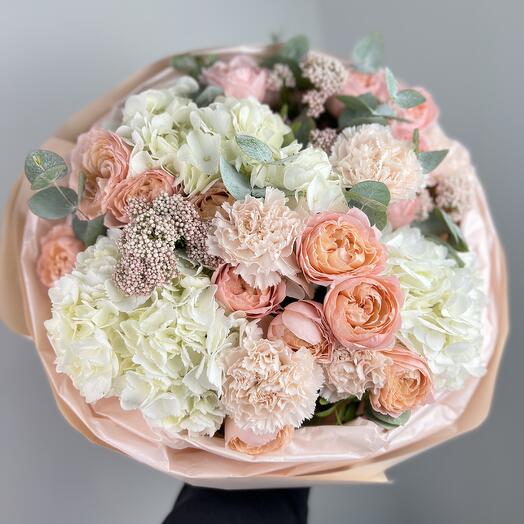 A gorgeous bouquet with white hydrangea, peach roses and dianthus