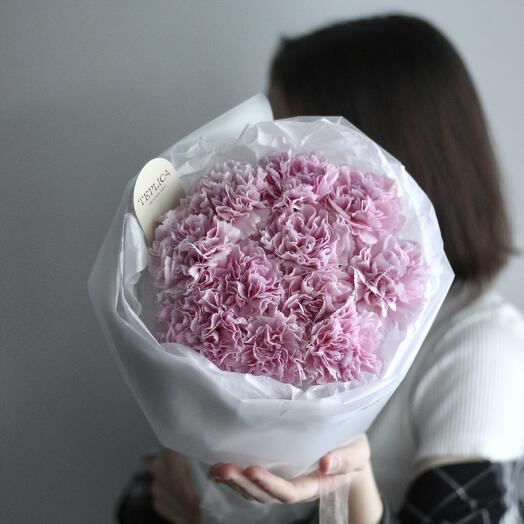 A round airy bouquet of pink dianthuses in a cool shade