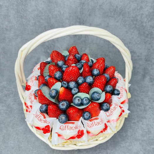 Strawberries with Raffaello candies in a basket