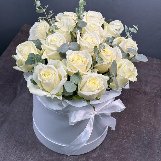 White roses with eucalyptus in a box