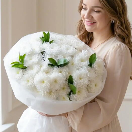 White bouquet of lace bush chrysanthemums and ruskus in designer packaging