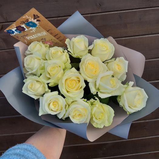 15 white roses in the design