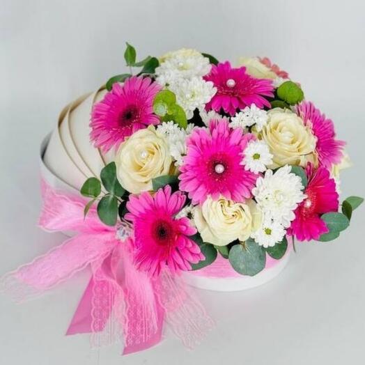 Flowers for the discharge of a girl daughter from the hospital in a gift box cradle