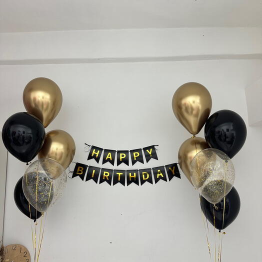 A set of balls with a garland of flags in black and gold