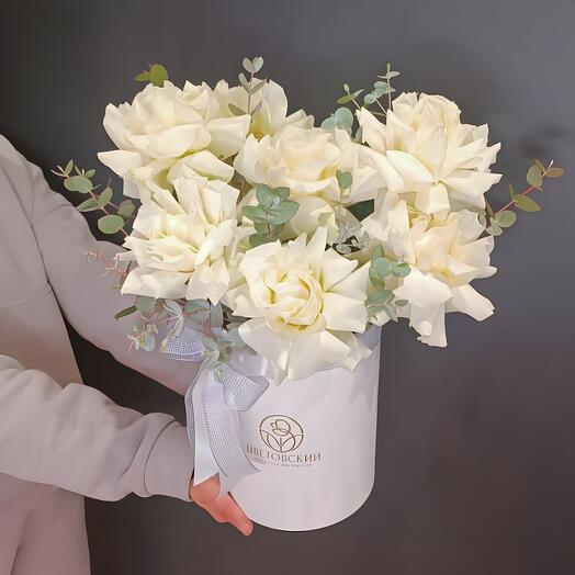 French roses with eucalyptus in the box