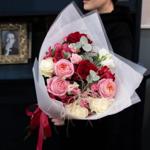 A large author's bouquet of French and peony-shaped roses with eucalyptus and cowslip