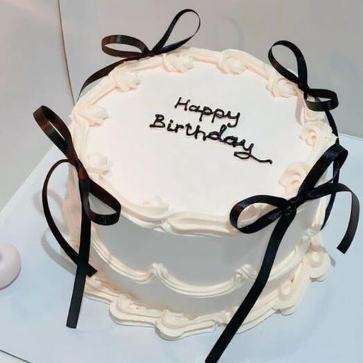 Elegant birthday cake with bows
