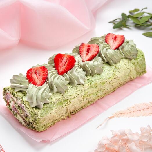 Rollo de merengue pistacho con frambuesas