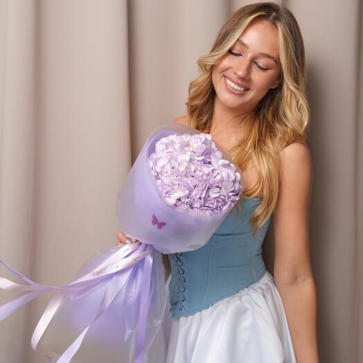 A delicate compliment bouquet of lavender hydrangeas in a minimalistic and stylish package