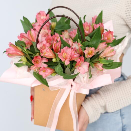 Pink alstroemeria in a kraft handbag