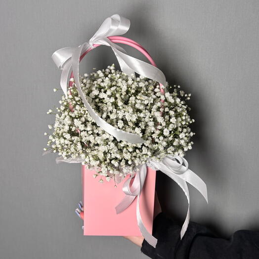 A white gypsophila in a pink handbag