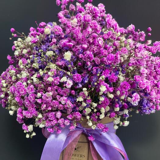 Colored gypsophila in a hatbox