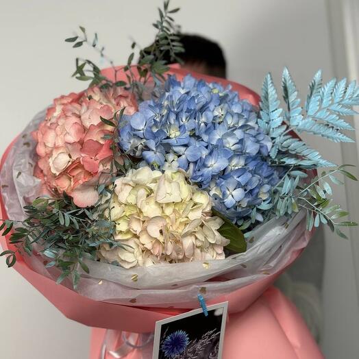 Bouquet of hydrangeas, ferns and pistachios