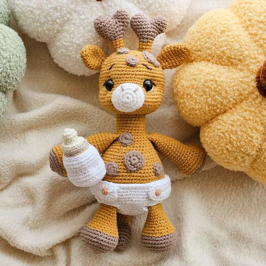 Knitted baby giraffe toy handmade