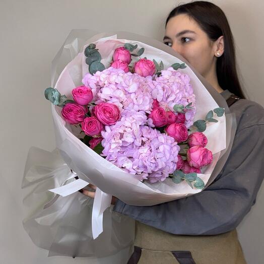 Bouquet with bushy peony-shaped roses and hydrangeas