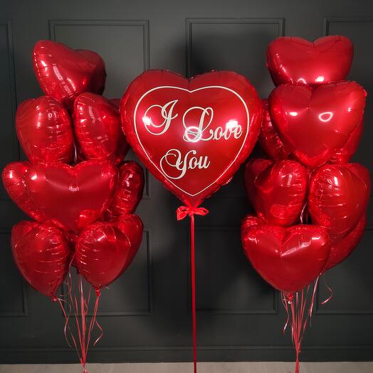 Composition of red hearts with a big heart I love you