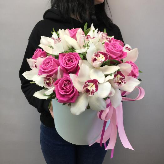 Roses and orchids in a hatbox