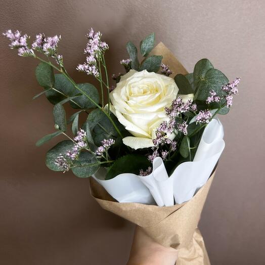 A compliment bouquet with a white rose