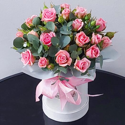 Flowers in a box. Bouquet "Marshmallow" of bush roses and eucalyptus in a hatbox