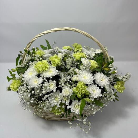 Basket with flowers in delicate tons