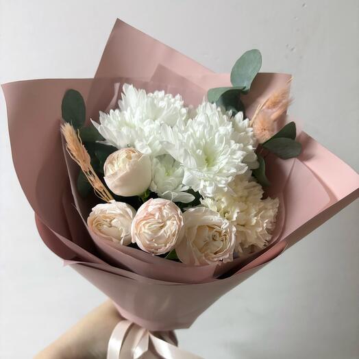 A compliment bouquet with a bush rose, chrysanthemums and a sprig of greenery in a delicate pink design