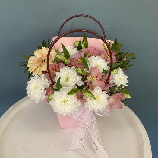 The flowers in the box are pale pink