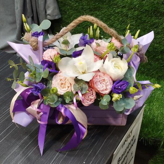 A box of cymbidium and bush roses