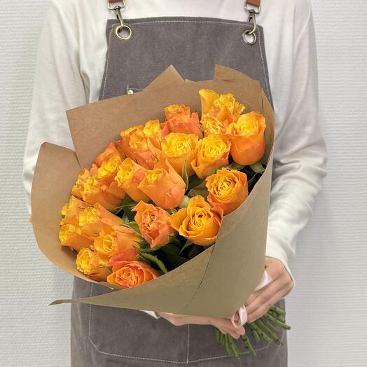 A bouquet of 21 orange Kenyan roses in a craft