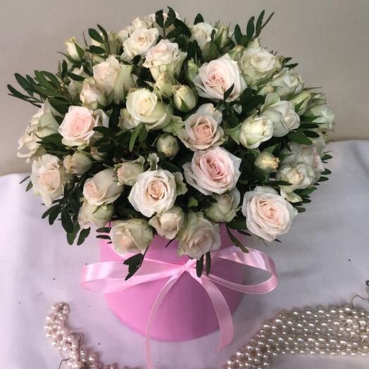 A box with a delicate bush rose