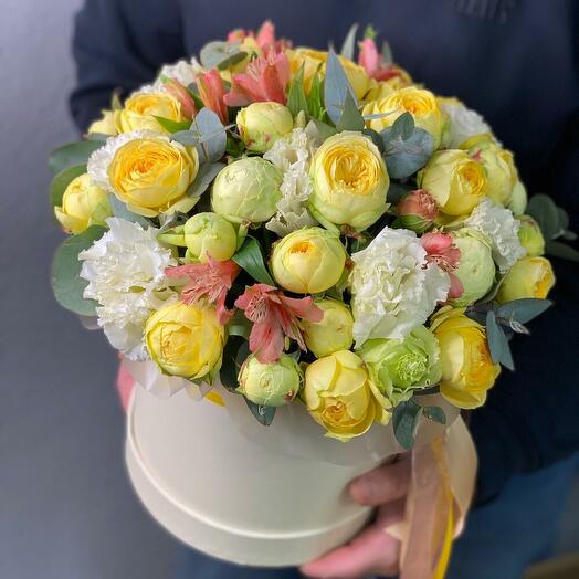 Flowers in a box with fragrant eucalyptus