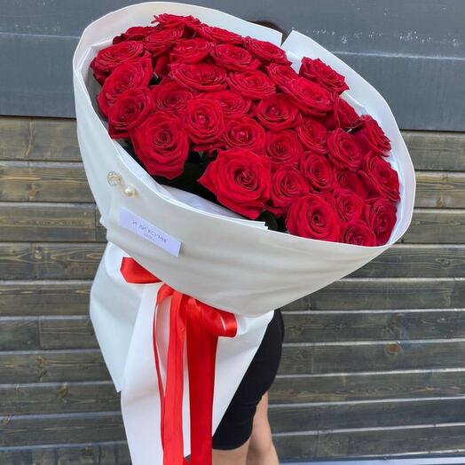 An armful of red velvet roses