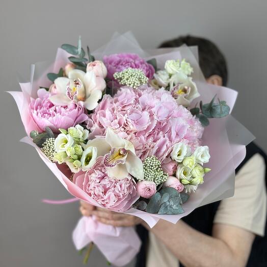 Love is bouquet of pink hydrangeas and peonies