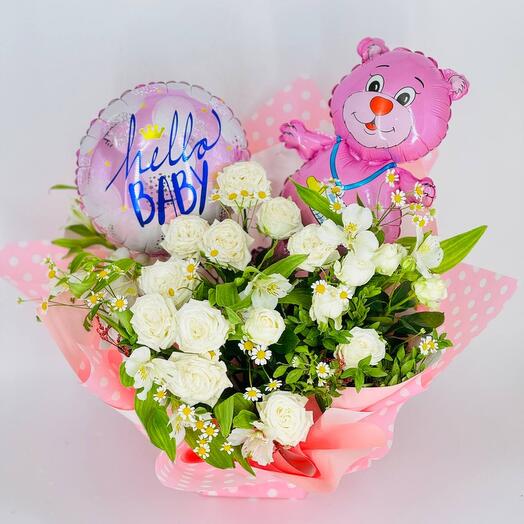 White rose flowers with field daisies and balloons for the discharge of a child from the hospital