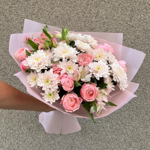 A delicate bouquet with a peony.A rose