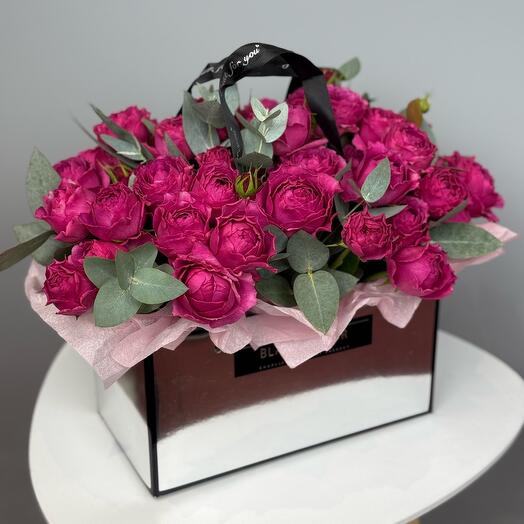 Peony-shaped roses in a handbag