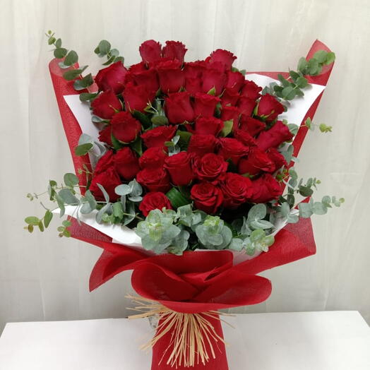 35 Stems of red roses nicely wrapping