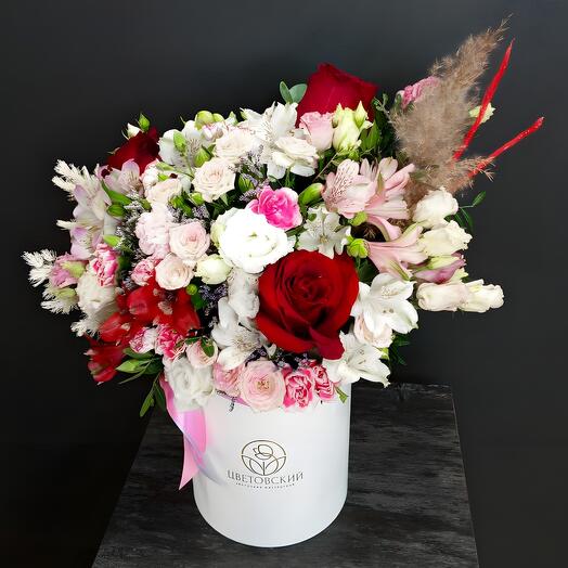 Composition with red roses and dried flowers