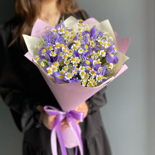 Bouquet with irises and fragrant daisies