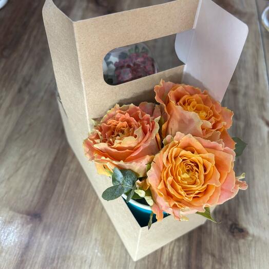 Flowers in a box with chocolate-covered strawberries