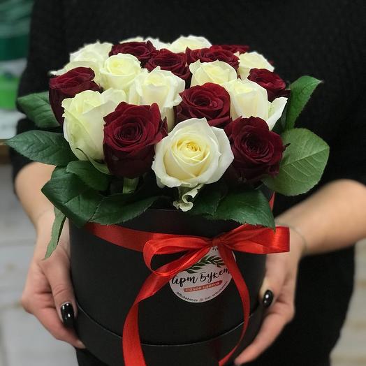 21 white and red roses in a box