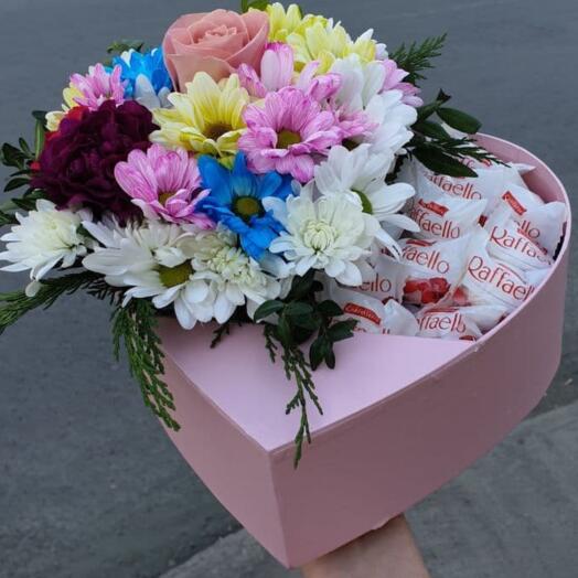 Composition of chrysanthemums, carnations and raffaello