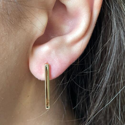 The earrings are elongated