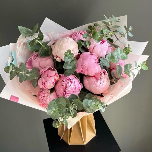 Bouquet of pink peonies and eucalyptus