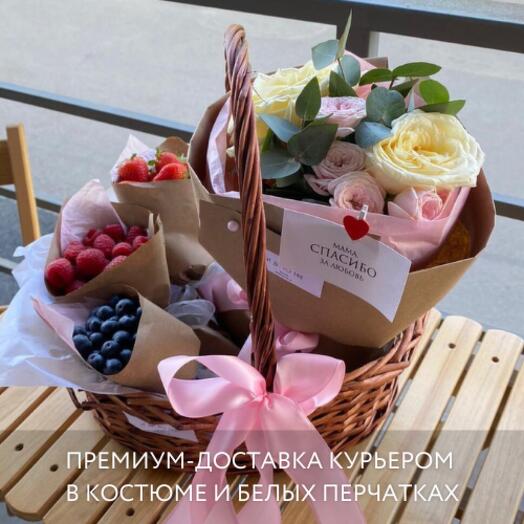 Basket with bouquet and berries